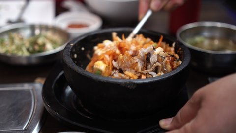 Korean food, Korean rice dish Bibimbap Korean mixed rice in a hot stone pot