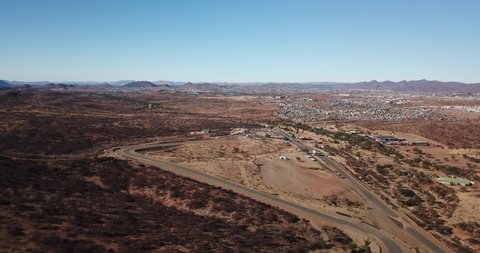 Windhoek, Namibia, 10.23.21: 4K aerial drone video of Tony Rust racing track near Otjomuise township on hot sunny day in southern Africa