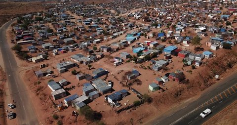 Windhoek, Namibia, 10.23.21: 4K aerial drone video of Otjomuise slums poor township near capital city on hot sunny day in southern Africa