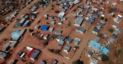 Windhoek, Namibia, 10.23.21: 4K aerial drone video of Otjomuise slums poor township near capital city on hot sunny day in southern Africa