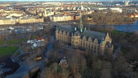 Aerial view of Stockholm old town. Flying over the bay. Amazing drone footage of Stockholm yacht canal and overlooking the Museum