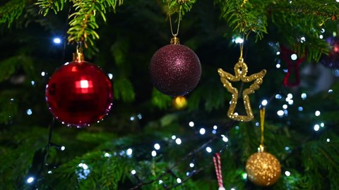 Christmas decorations on a Christmas tree (fir), Christmas tree lights blinking, angel