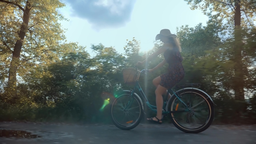 Carefree Girl Cyclist On Vacation. Bicycling On Holidays. Pretty Girl Having Fun. Bicycle Adventure. Woman Cyclist Riding Road Bike. Cycling Leisure And Hobbies. Woman Riding Mountain Bike In Park  Royalty-Free Stock Footage #1084548610
