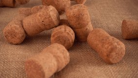 Champagne wine corks fall onto the burlap. Slow motion. - Powered by Shutterstock - Get 15% off with code: PIKWIZARD15