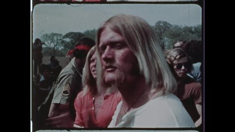 1971 Washington, DC. Hippie Protestors at a Free Rock and Roll Concert for 1971 May Day Protest. Drug Overdose and Drug Abuse is rampant during the counterculture protest. 4K Overscan of Vintage Film