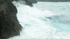 Waves crash into the rockcliff | Broken beach - Nusa Penida | Bali 4K video