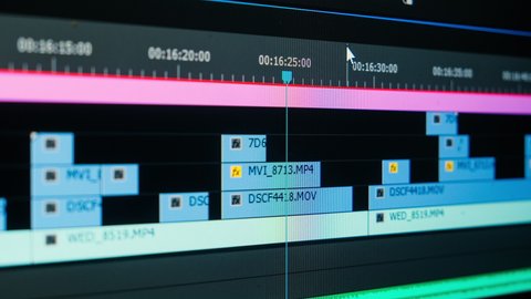 The movie editor highlights, selects, and moves footage in a timeline editing project in a computer program macro mode. time-lapse editing of a TV show, film
