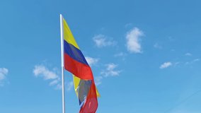 Bolivia. National country flag on blue sky background. Flying fabric symbol. Tourism or travel summer day. international patriotic emblem. Nobody. Horizontal video