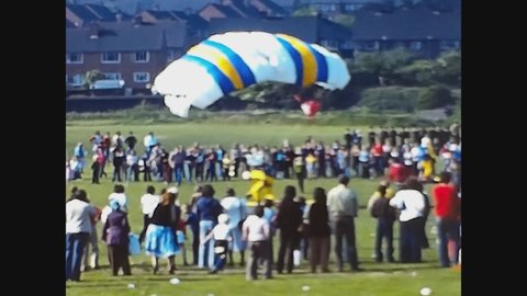 LONDON, UNITED KINGDOM JUNE 1977: Man goes down with parachute in 70's