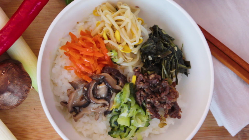 Korean traditional food, Bibimbap, mixed vegetable with rice Royalty-Free Stock Footage #1084577743