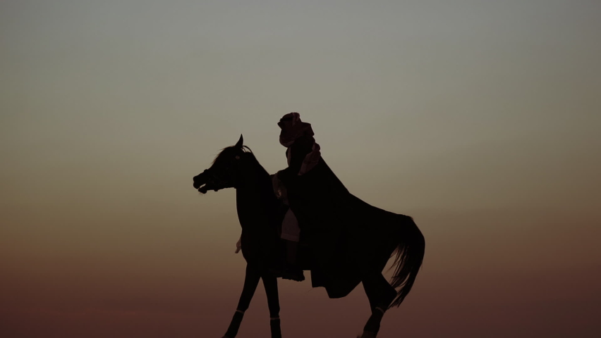 An Arab Person With Horses in the desert at sunset 6 | Shutterstock HD Video #1084580191