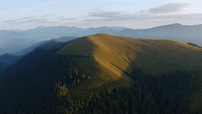 Gorgeous green hills from a bird's eye view. Location place Carpathian mountains, Ukraine, Europe. Wild territory of national park. Cinematic drone shot. Filmed in UHD 4k video. Beauty of earth.