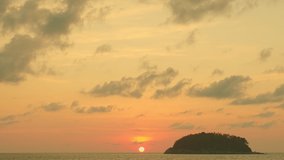 time lapse scenery yellow sun going down to the sea.
beautiful moving cloud in sweet sky at sunset in Kata beach Phuket Thailand
4k stock footage video in travel concept.