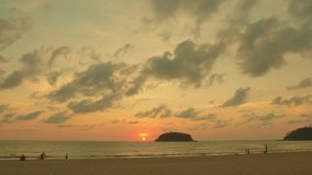 scenery red sky the sun down to the sea.
beautiful red sky at sunset in Kata beach Phuket Thailand
4k stock footage video in travel concept. red sky background.