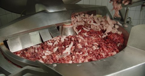  Grinding meat with lard and spices in a large centrifuge..jpg
