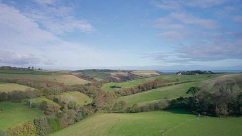 English Village, Farmlands and Meadows from a drone, Devon, England