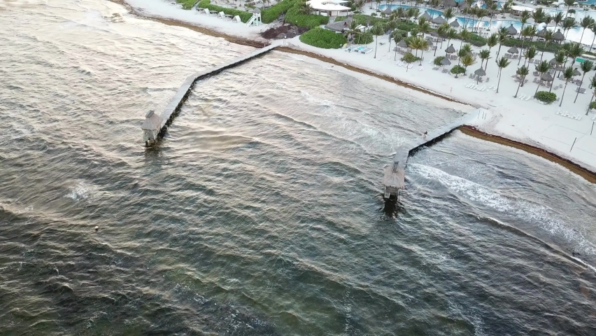 Aerial View Of Wooden Jetties At Riviera Maya Coast, Yucatan Peninsula, Quintana Roo, Mexico. Pullback