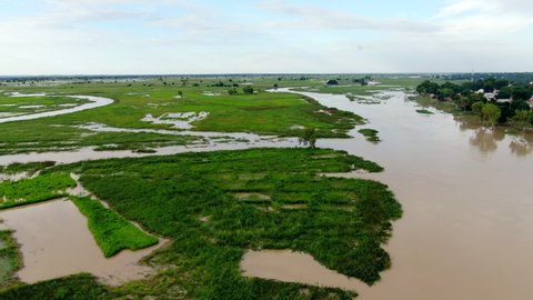 The flooded Argungu river and tributaries that flow through Nigeria's Kebbi State - sweeping panoramic aerial view