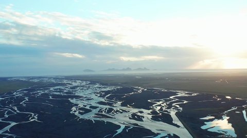 Scenic tributary stream river, natural estuary landscape, aerial view of Iceland