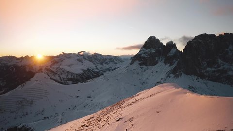 Golden sunset over a snow-covered Passo Sella