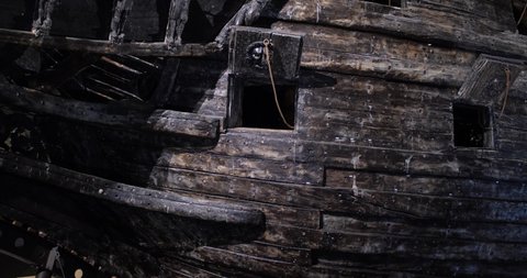 Close up view of spots where cannons were installed in the wrecked swedish warship Vasa built during 1626 in 1628, located in Vasa museum, Stockholm, Sweden. 4K video.