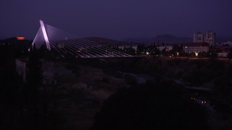 PODGORICA, MONTENEGRO - SEPTEMBER 15, 2021: Before sunrise view on Millennium Bridge in Podgorica, Montenegro. Editorial, 4K. Contains binaural audio