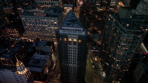 evening flying over Chelsea and tilting up on view of midtown NYC