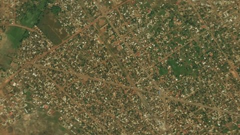 Zoom of the earth from space to the city. 3D Animation. Zoom in to the city of Cancan, Guinea . Stock video footage. 4K
