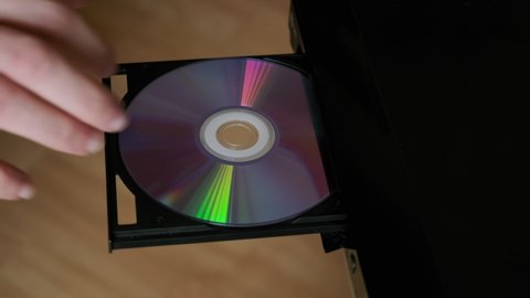 Shot Insert Disc to DVD player. Loading Compact Disc From The DVD, CD Player. top view