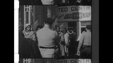 1965 Birmingham, AL. Despite  poll taxes and literacy tests, Martin Luther King begins Voter Registration campaign which eventually established Voting Rights Act into law. 4K Overscan of Archival Film
