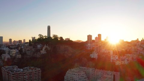 4K drone aerial shot of San Francisco downtown and Coit Tower at sunset - California, United States of America
