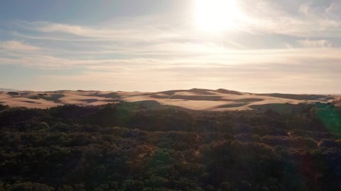 4K drone aerial shot of Pismo Beach sand dunes and Pacific Coast at sunset - California, United States of America