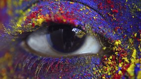 Closeup of eyes smeared with Holi colors, India - Powered by Shutterstock - Get 15% off with code: PIKWIZARD15