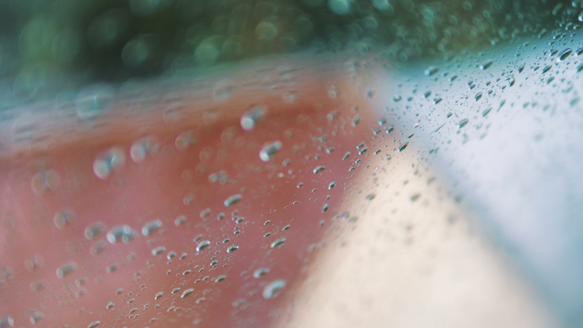 Rainy day behing the window in 4k slow motion 60fps