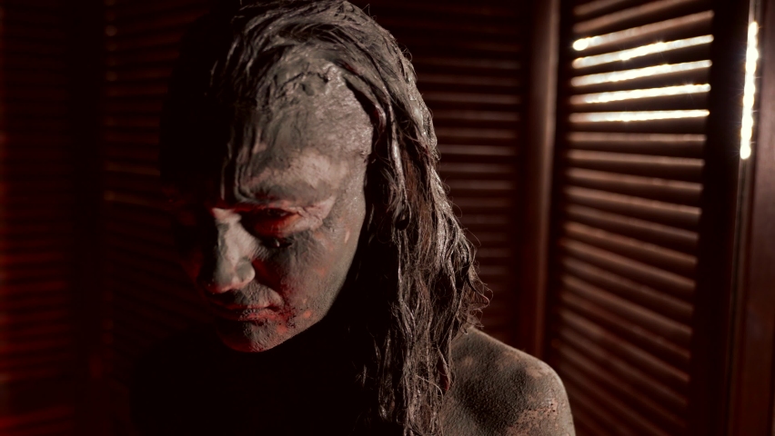 woman in cosmetic or artistic clay, portrait of emotional lady, model for art performance