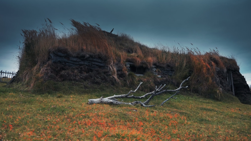 A stone-age turf hut in the historic fishing village of Mortensnes on the shores of Varanger Norway.