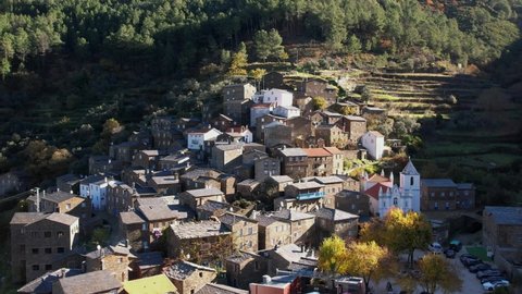 DRONE AERIAL FOOTAGE: The picturesque little schist villages of Piodão clings to a steeply terraced mountainside deep within the foothills of the Serra de Açor range in central Portugal. 