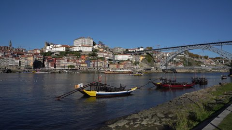 Traditional boats at the Gaia pier on the Douro river in the center of Porto, Portugal, November 9 2021