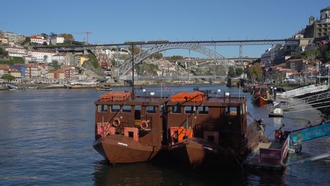 Tourists leaving a traditional boats at the Gaia pier on the Douro river in the center of Porto, Portugal, November 9 2021