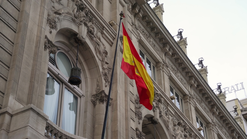 Spanish flag on classic building in the old town center of Madrid, Spain