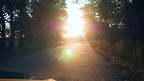 Driver POV Windshield Vehicle Windscreen View Car Hood. Autumn Evening Sunset Highway Country Road Near Plowed Field. 2x Slow motion 60fps 4K - Powered by Shutterstock - Get 15% off with code: PIKWIZARD15