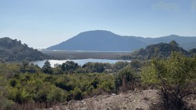 Wonderful panoramic landscape Sea reeds Mountains sky natural different perspective combo Tourism travel sightseeing vacation Dalaman Turkey 4K video shoot natural background images buying now.