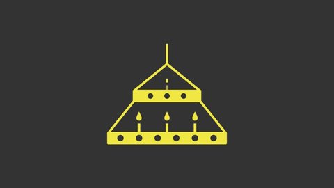 Yellow Massive steel chandelier with candles in medieval icon isolated on grey background. 4K Video motion graphic animation.