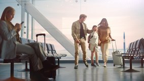 Airport Terminal Family Reunion: Caring Father Meets His Cute Little Daughter and Beautiful Wife at the Boarding Lounge of Airline Hub. He Picks Up and Dances with Lovely Child and Hugs His Partner - Powered by Shutterstock - Get 15% off with code: PIKWIZARD15