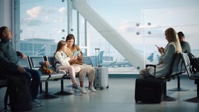 Airport Terminal: Cute Mother and Little Daughter Wait for their Family Vacation Flight, Play Educational Games on Digital Tablet. People Sitting in Boarding Lounge of Airline Hub with Airplanes Fly - Powered by Shutterstock - Get 15% off with code: PIKWIZARD15