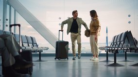 Airport Terminal Family Reunion: Beauitful Couple Meets at the Boarding Lounge. Smiling Girlfiend Meets the Love of Her Life after Long Parting and Hugs and Dances with Her Handsome Partner - Powered by Shutterstock - Get 15% off with code: PIKWIZARD15