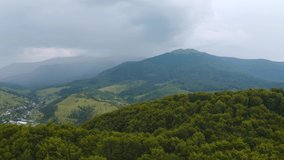 Heavy rain floods the mountains in the spring. Bird's eye view. Location place Carpathian mountains, Ukraine, Europe. Cinematic drone shot. Filmed in UHD 4k video. Discover the beauty of earth.