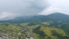 Heavy rain floods the mountains in the spring. Bird's eye view. Location place Carpathian mountains, Ukraine, Europe. Cinematic drone shot. Filmed in UHD 4k video. Discover the beauty of earth.