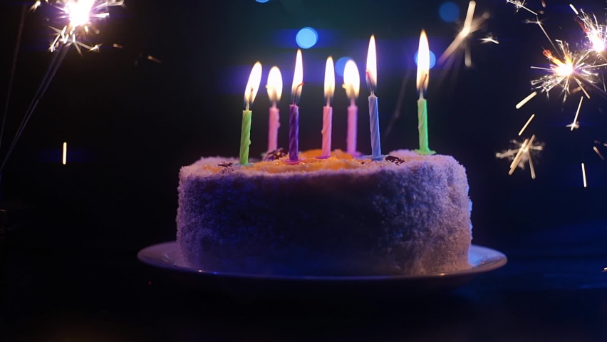 A birthday cake with candles and sparklers on both sides without guests Royalty-Free Stock Footage #1084641301