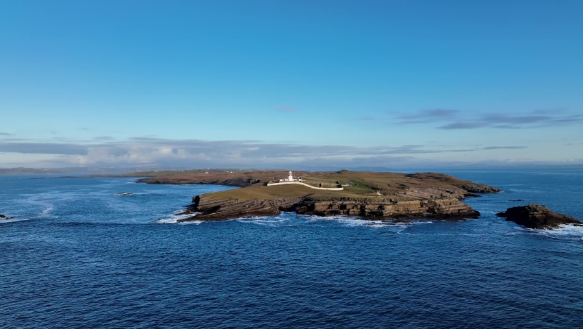 Aerial view of St Johns Lighthouse in Donegal Ireland over atlantic.  Zoom in